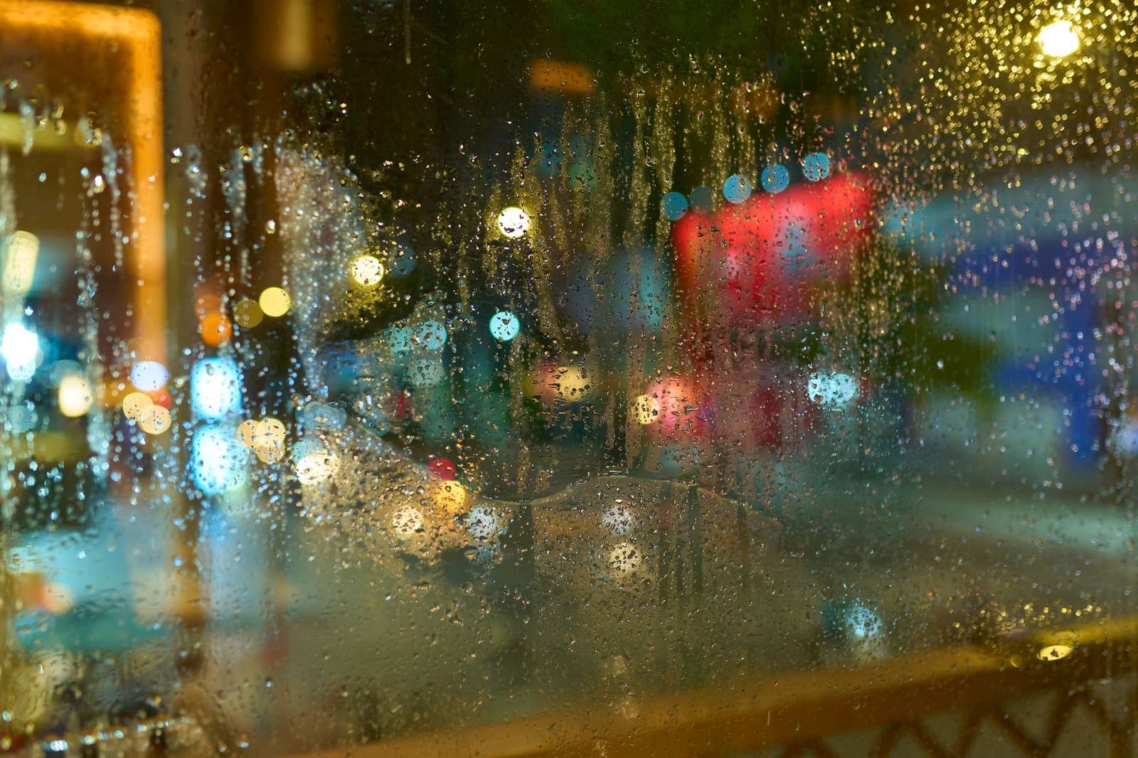 Fogged café windows with the street busy outside.