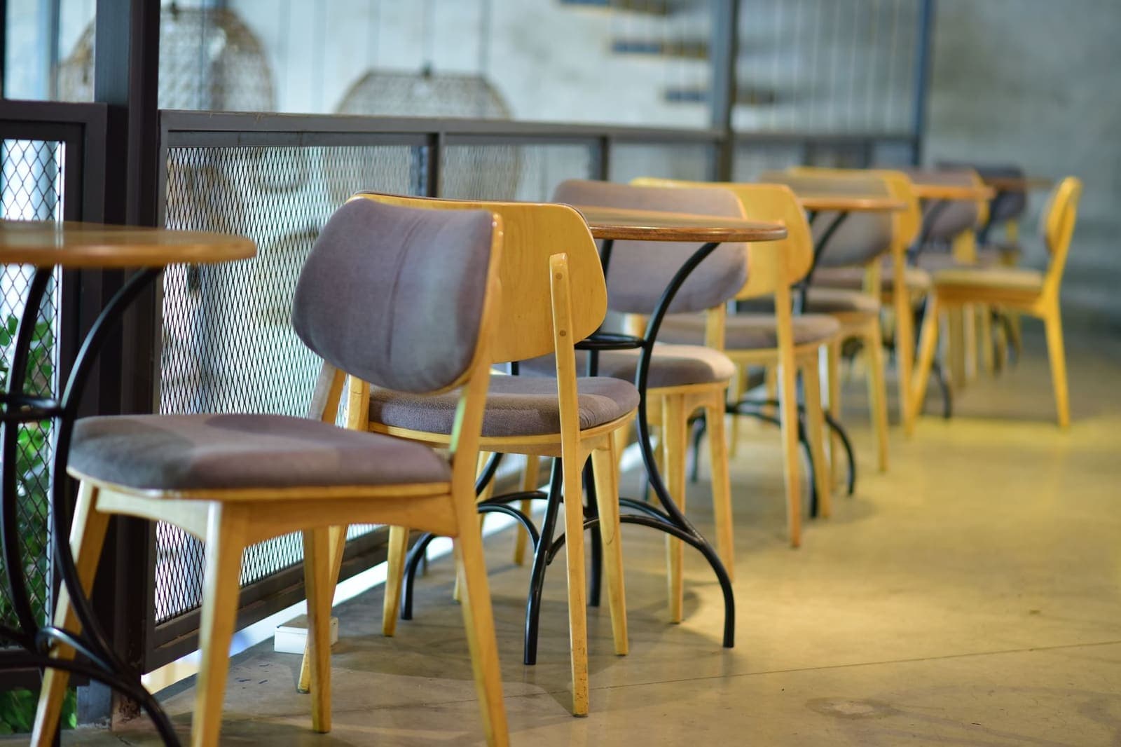 A room with more empty chairs than people.